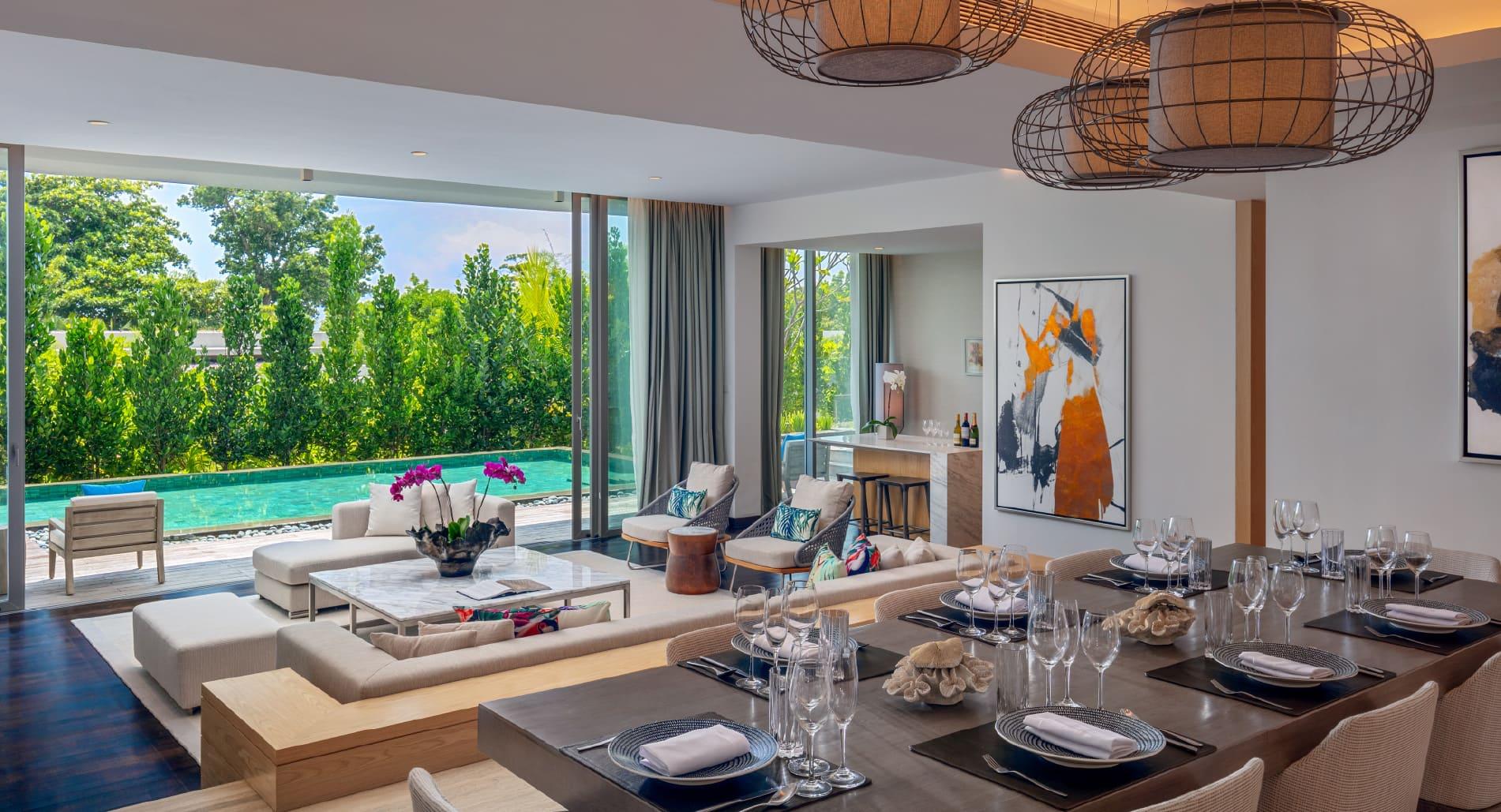 Open-plan living and dining space opening onto a private pool terrace